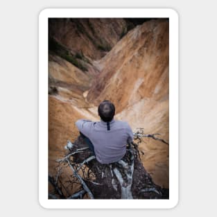 Sitting on the edge of a cliff Sticker